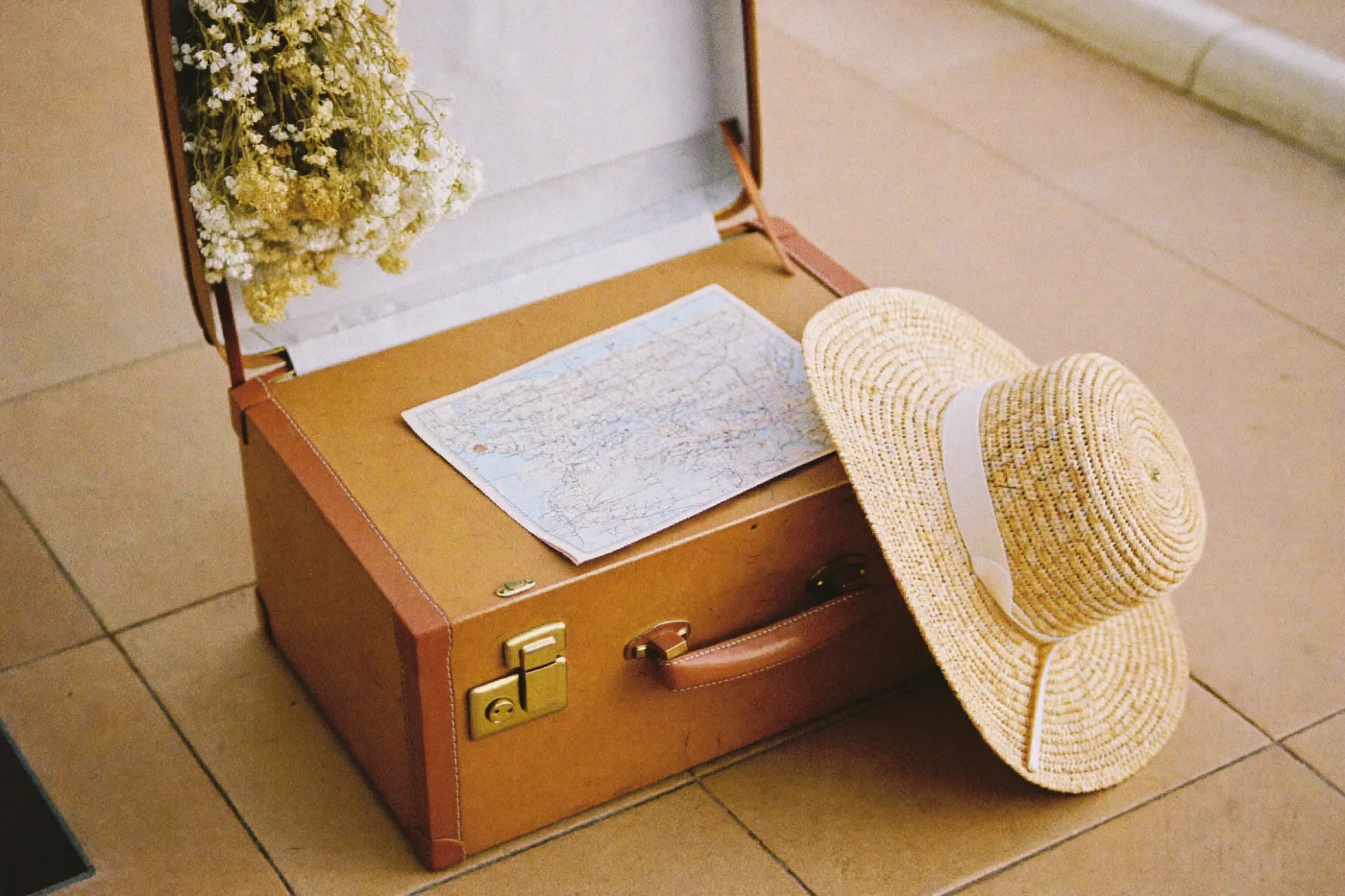 A vintage suitcase and map for the honeymoon